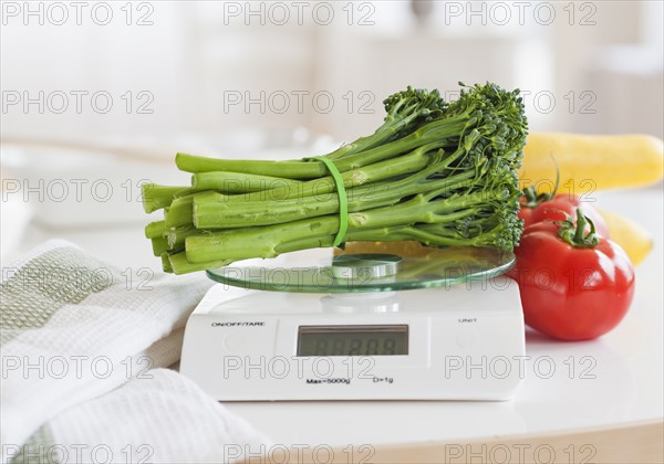 Fresh vegetables on weight scale.