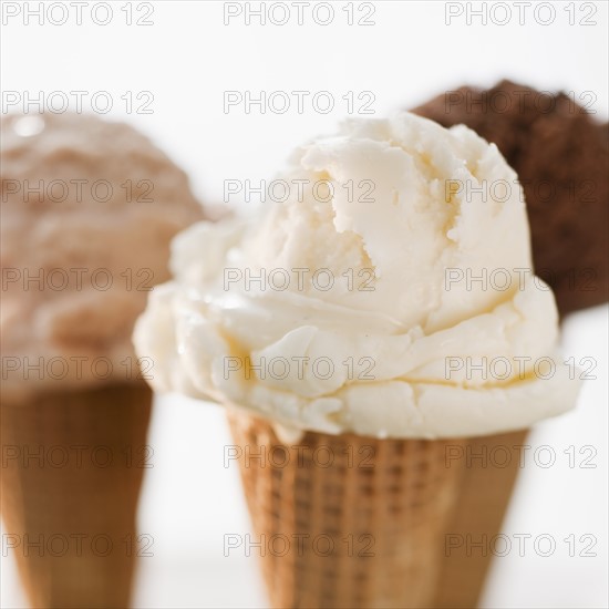 Close up of various ice cream cones.