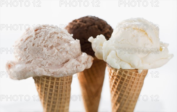 Close up of various ice cream cones.