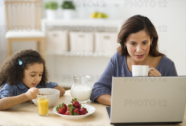 Mother and daughter (6-7) during breakfast.