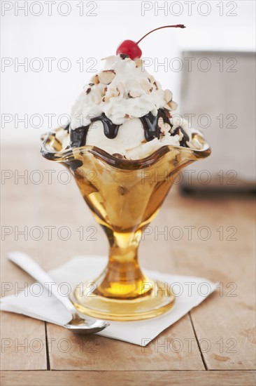 Close up of sundae with cherry on top.
