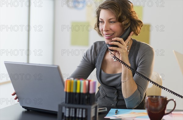 Woman working in home office.