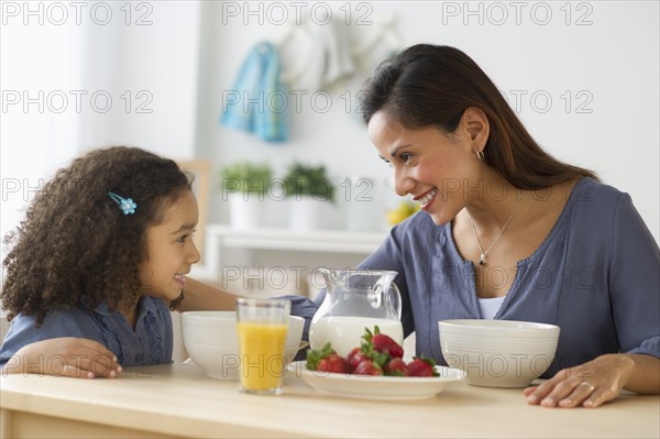 Mother and daughter (6-7) during breakfast.