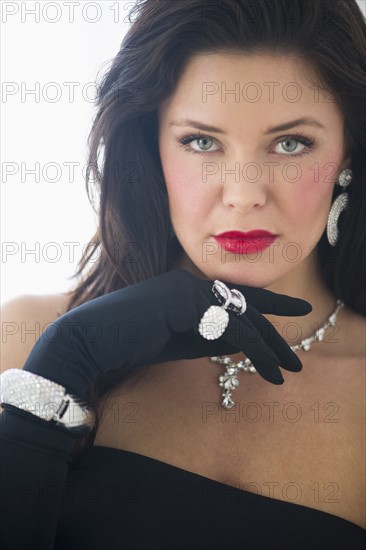 Portrait of young woman in evening wear.