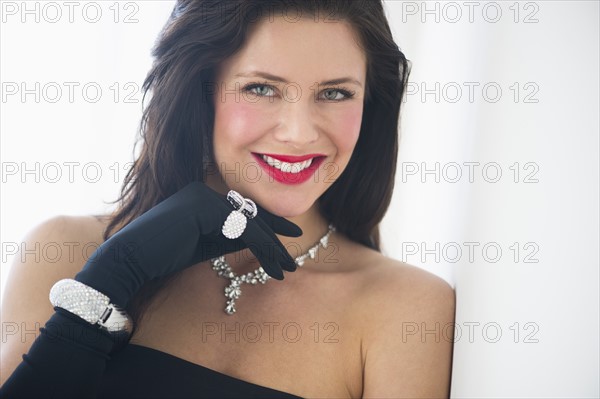 Portrait of young woman in evening wear.