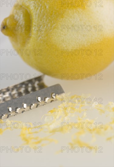 Close-up of lemon and grater. Photo : Jamie Grill Photography