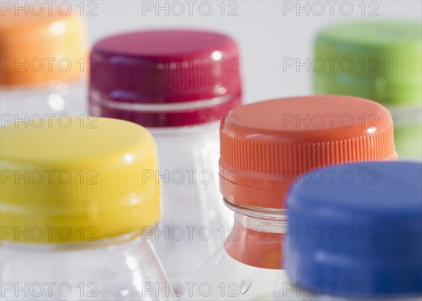 Bottles with colorful caps. Photo : Jamie Grill Photography