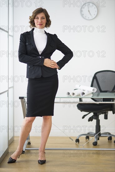 Businesswoman posing in office.