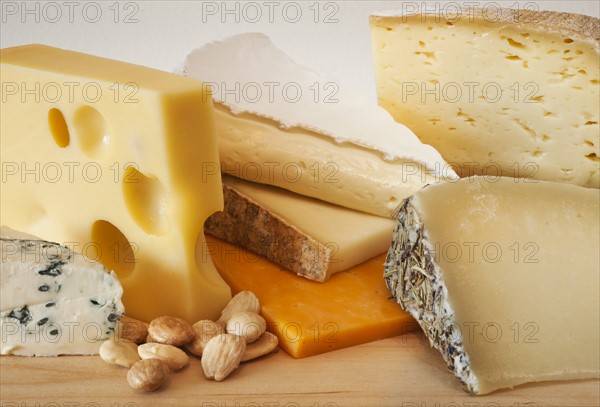 Various cheeses on chopping board.