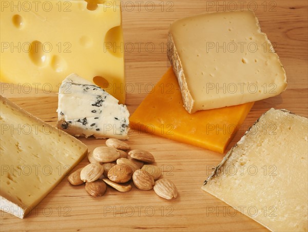 Various cheeses on chopping board.