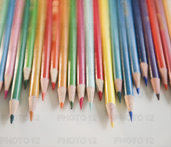 Studio shot of colored pencils in row. Photo : Jamie Grill Photography