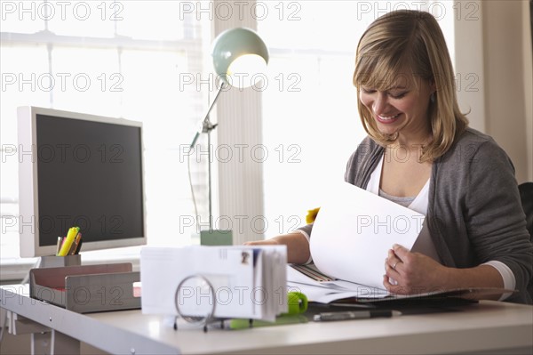 Woman working in office. Photo: DreamPictures