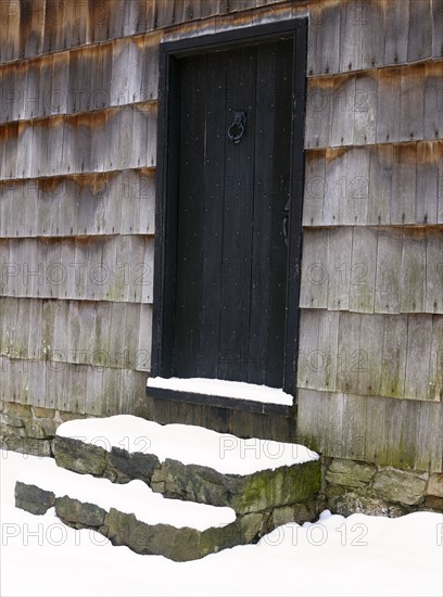 USA, New York State, Door to barn covered with snow. Photo: John Kelly