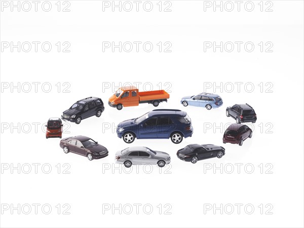 Circle of different cars on white background. Photo: David Arky