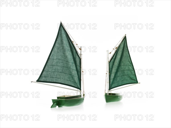 Two toy boats on white background. Photo: David Arky
