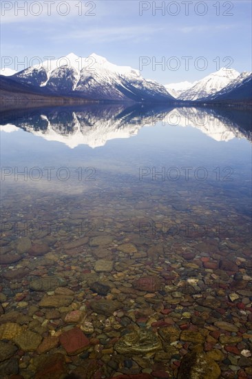 USA, Colorado, Mountains reflected in lake. Photo: Noah Clayton