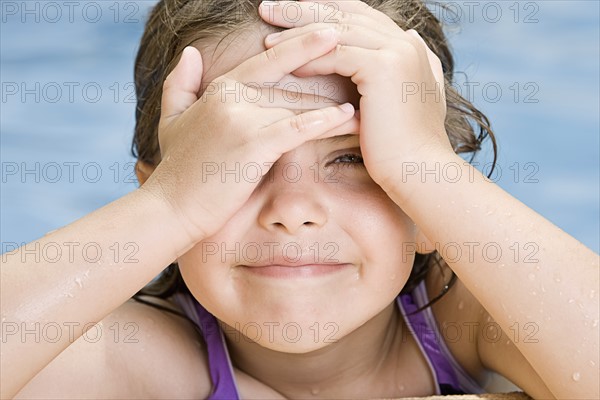 Girl (6-7) in swimming pool. Photo : Justin Paget