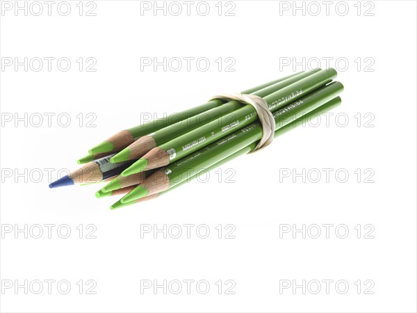 Studio shot of bunch of green pencils with one blue. Photo : David Arky