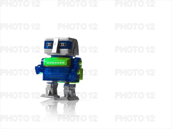 Toy robot on white background. Photo : David Arky