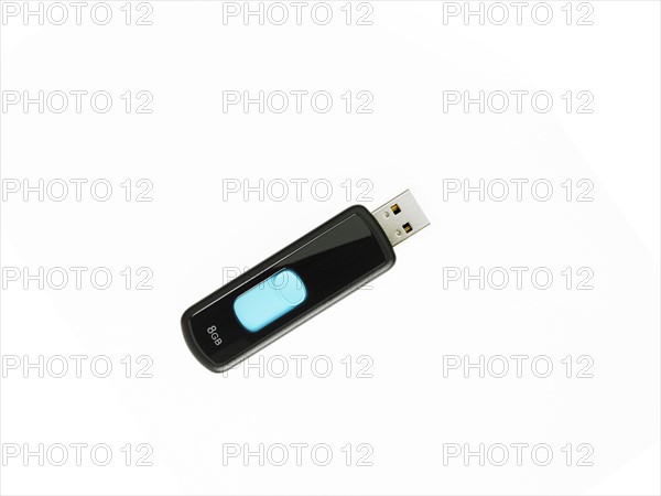 USB stick on white background. Photo : David Arky