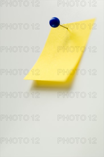 Studio shot of yellow adhesive note. Photo : Antonio M. Rosario