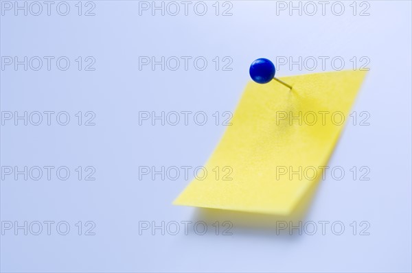 Studio shot of yellow adhesive note. Photo : Antonio M. Rosario