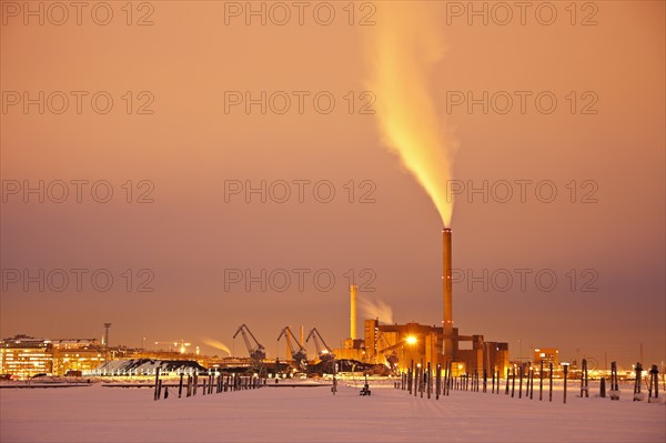 Finland, Helsinki, Smoking chimney in dock. Photo : Henryk Sadura
