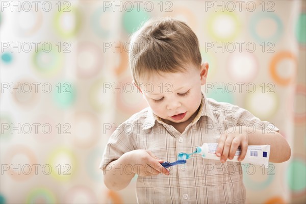 Boy (2-3) brushing teeth. Photo: Mike Kemp