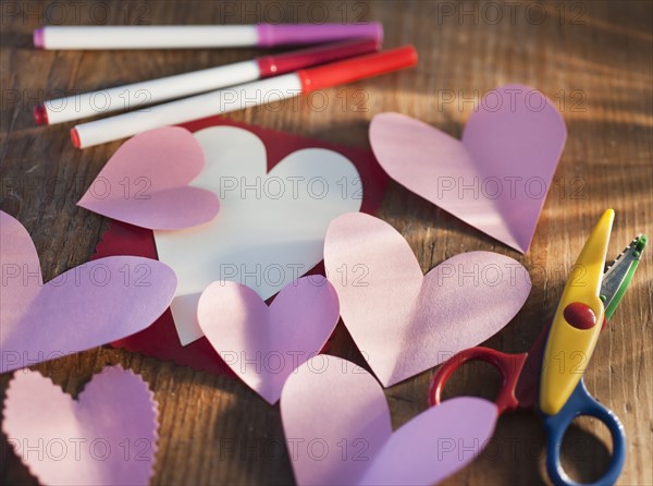 Studio shot of heart-shaped paper cutouts. Photo: Daniel Grill