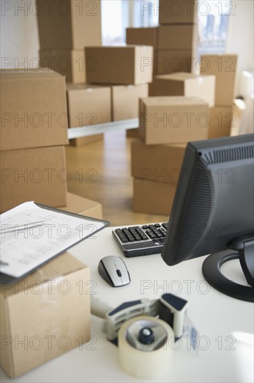 Boxes and computer at delivery warehouse.