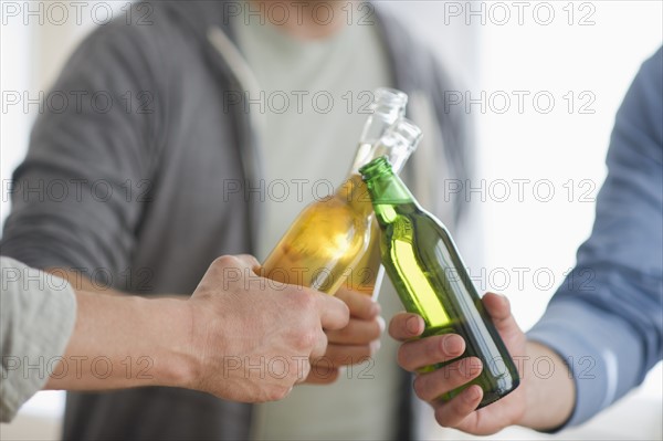 Men toasting with beer.