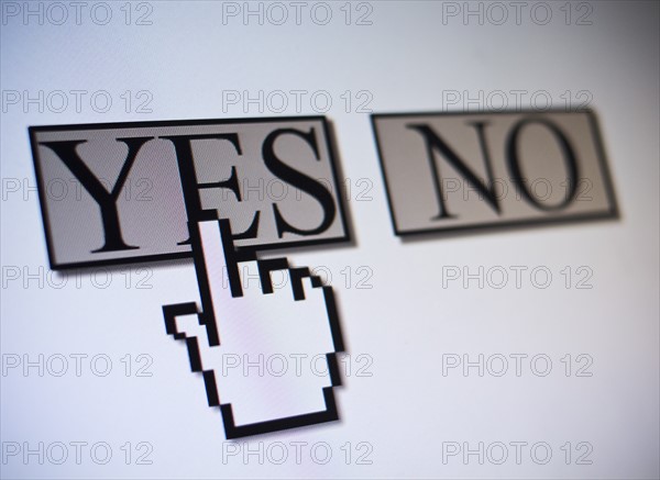 Studio shot of hand cursor on yes button. Photo : Jamie Grill Photography