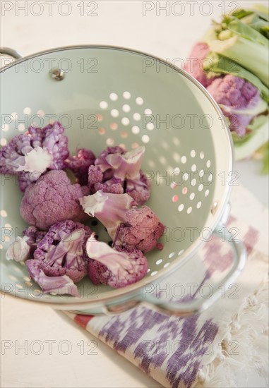 Studio shot of cauliflower in colander. Photo : Jamie Grill Photography