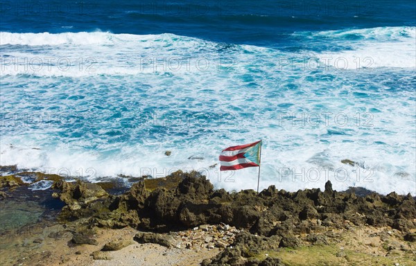 Puerto Rico, Old San Juan, flag of Puerto rice on sea coast.