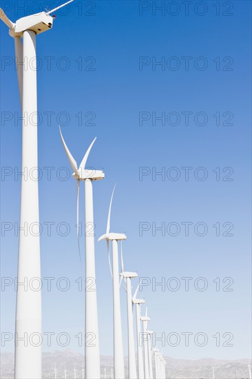 USA, California, Palm Springs, Coachella Valley, San Gorgonio Pass, Wind turbines against blue sky. Photo : Jamie Grill Photography