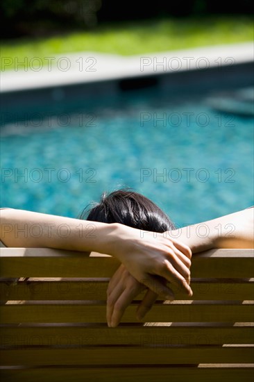 Woman relaxing in chair. Photo : Maisie Paterson