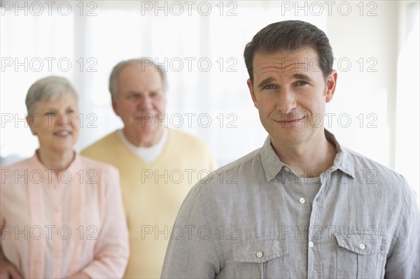 Senior parents with adult son.