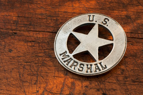 Close-up of United States Marshal badge.