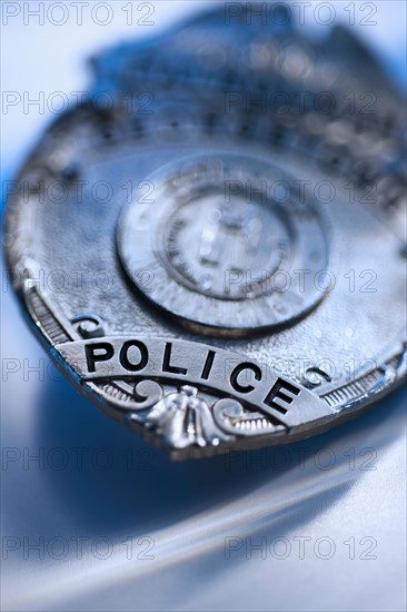 Close-up of police badge, studio shot.