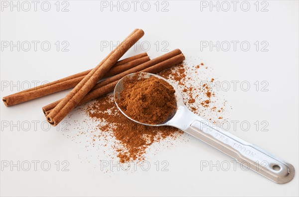 Studio shot of cinnamon stick and cinnamon powder.