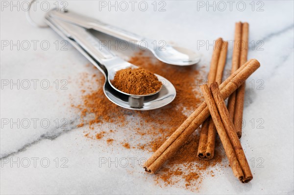 Studio shot of cinnamon stick and cinnamon powder.