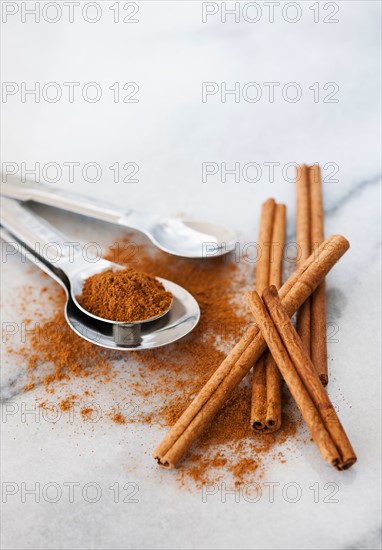 Studio shot of cinnamon stick and cinnamon powder.