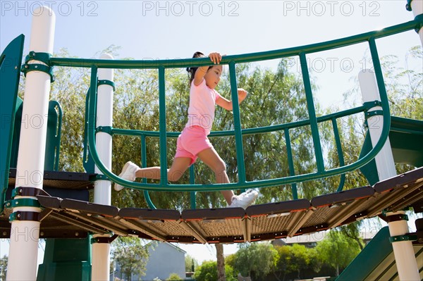 USA, California, Girl (4-5) playing in playground. Photo : Noah Clayton