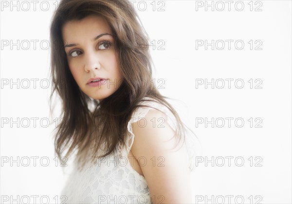 Studio portrait of young woman.