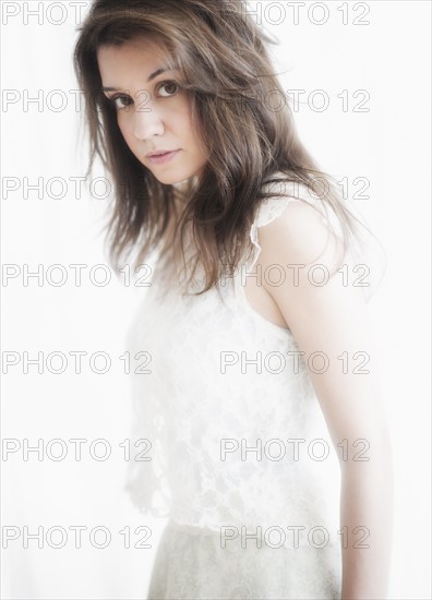 Studio portrait of young woman.