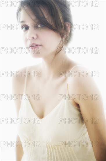 Studio portrait of young woman.