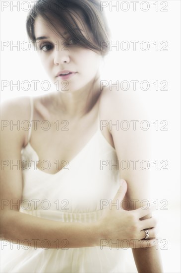 Studio portrait of young woman.