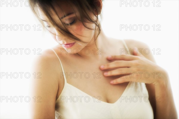 Studio portrait of young woman.