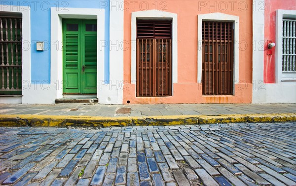 Puerto Rico, Old San Juan, door in houses on brick street.
