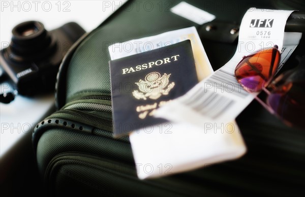 Close up of passport and travel accessories.